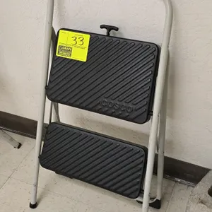 Cosco folding 2-step stool. Features a metal frame with slip-resistant treads.