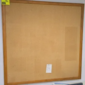 Cork board. Features a wooden frame. 4' x 4'.