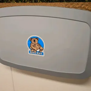Koala Kare poly changing table. Features a wall-mounted fold-down design.