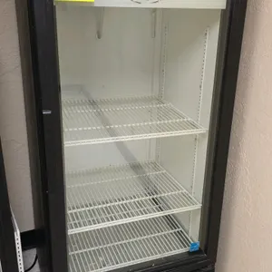 True GDM-10-LD self-contained single glass door display refrigerator. Features a black exterior finish and (3) interior wire shelves. 2' x 2' x 4.5'. 
