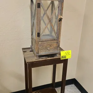 Wood side table and wood lantern decor. Includes a dark finish wood side table with a lower shelf, and a distressed wood lantern-style decor piece fea