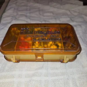 Mini magnum pocket pack fishing container with contents