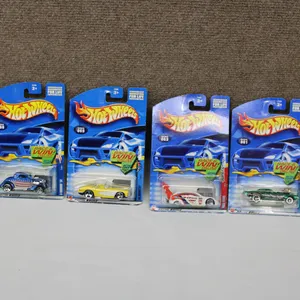 Four Hot Wheels Die-Cast Cars in Original Packaging