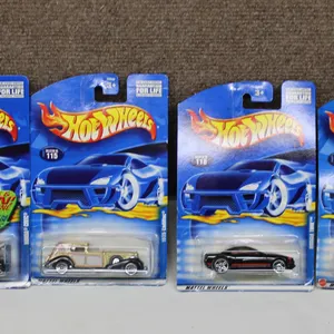 Four Hot Wheels Die-Cast Cars in Original Packaging