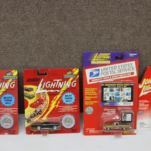 4 Johnny Lightning Die-Cast Cars in Original Packaging