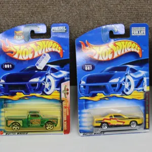 4 Hot Wheels Die-Cast Cars in Original Packaging