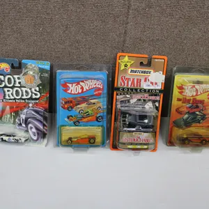 4 Die-Cast Cars in Original Packaging from Hot Wheels and Matchbox