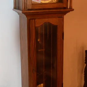 Grand Father Clock, works, has a chime, The clock Height from the spindle on top to the bottom is 6‘1“.  The depth is 9 1/4inches. width 17 inches.