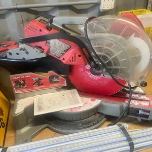 12" Milwaukee compound mitre saw *THIS ITEM AVAILABLE FOR LIVE ON-SITE BIDDING ONLY