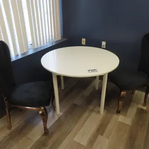 Lot - 41" Round White Table w/ (2) Black / Brass Chairs.