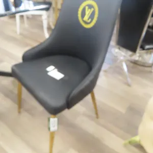 (6) Louis Vuitton Black Accent Chairs.