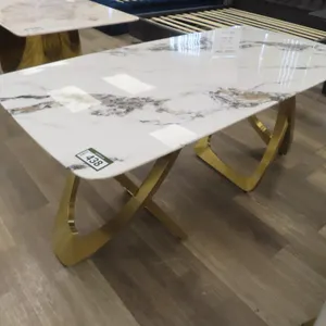 American Goose 36" x 71" White Marble Style, Brass Base Table.