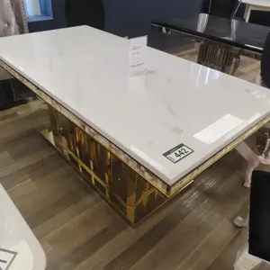 American Goose 36" x 71" White Marble Style, Brass Base Table.