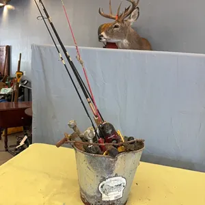 Bucket with fishing poles, gate hinges