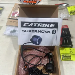 Catrike Supernova bicycle headlight and taillight system. Includes mounting bracket and wiring. Original packaging included.
