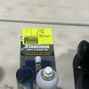 Assorted bicycle lubricants. Includes (1) 4 oz Rock 'N' Roll Extreme chain lube, (1) 5 oz Finish Line Pedal & Cleat dry film lubricant, and (1) 15 g F