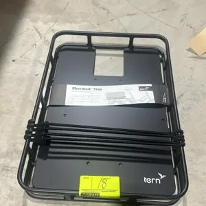 Tern Shortbed Tray rear mounted bicycle cargo tray. Features black metal construction. Includes bungee tie-down cords.