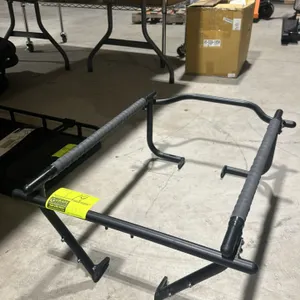 Tern child seat stand for an electric bicycle. Features a black tubular metal frame with padded side rails and mounting hardware.