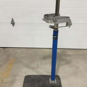 Park Tool PRS-3.2 single arm repair stand. Features a micro-adjust clamp and cast aluminum tool tray. Mounted on a heavy steel base plate.