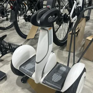 Segway electric 2-wheel transport vehicle. Features a white finish, knee control bar, and dual footpads.