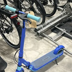 Ninebot Kids electric scooter. Features a folding design, textured deck, and kickstand. Note: Needs repair, won't charge.