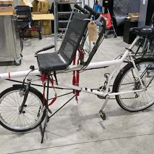 PinO Spezialrader upright/recumbent tandem bicycle. Features a recumbent front seat with a mesh back and an upright rear saddle. Equipped with dual pe