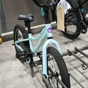 9” Frame Liv Adore kids pedal bike with 16” wheels . Features a light blue frame, single speed, chain guard, and bell.