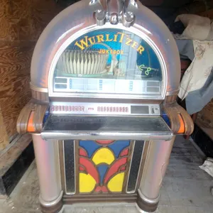 Wurlitzer Jukebox with Stained Glass Panel and Chrome Accents Modle 1050