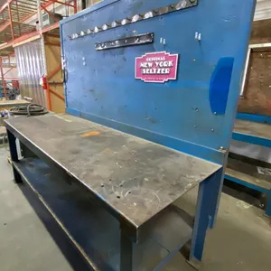 BLUE METAL WORKBENCH WITH WOOD BACK BOARD APPROX 96"L X 34"D X 84"H