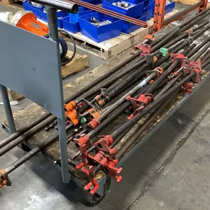4 WHEEL 6'L PLATFORM WORK DOLLY WITH APPROX 16 ASSORTED SIZE BAR CLAMPS