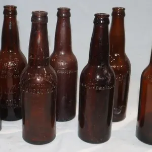 8 Wisconsin Embossed Brown Glass Bottles: