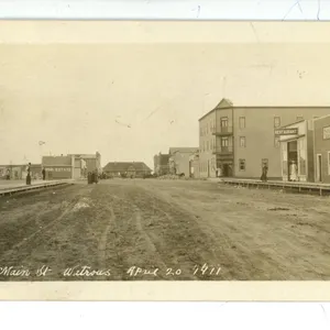 RPPC – “Main St. Watrous (SK).  April 20, 1911”.  Posted.