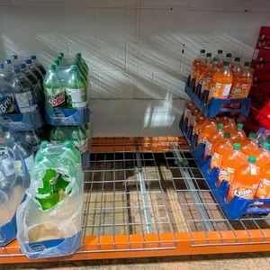LARGE LOT OF ASSORTED POP INCLUDES PEPSI, BRISK,