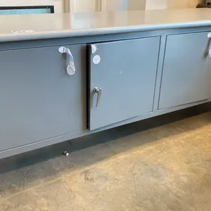 ULINE GREY 4 DOOR ADJUSTABLE HEIGHT WORK CABINET WITH ASSORTED CONTENTS- COFFEE PODS, GLOVES, PAPER