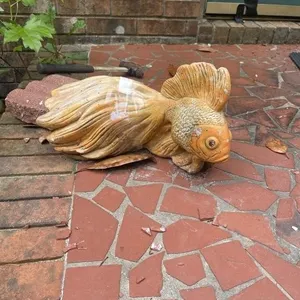 Concrete Fish on Front Steps of house.