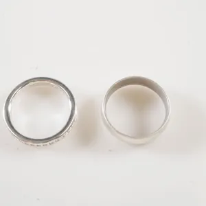 Lot of (2) White Metal Rings