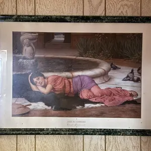A Cool Retreat Framed Print by John Godward