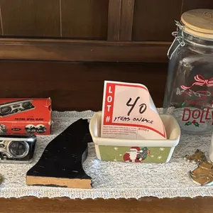 Items on lace, mugs, opera glasses, and more