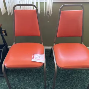 2 metal chairs with cushion seats, orange