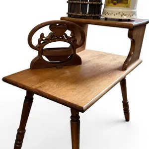 Wooden Table With Decorative Accessories Including Wooden Press, Heart Motif Stand, and Painted Cera