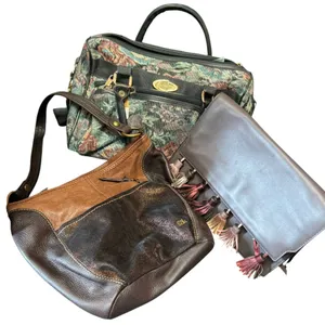 Three Bags Including Tapestry Satchel, Leather Shoulder Bag, and Tassel Clutch