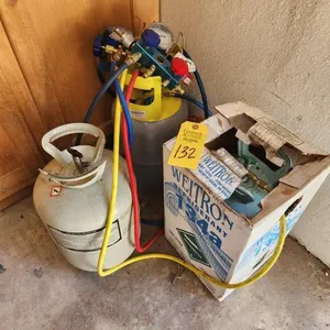2 Sets of AC Gauges, (One Poor Condition) 3 Tanks of 134A Refrigerant (1 Empty & 2 at 20% Full)
