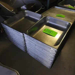 2 Stacks of SS Steam Table Inserts