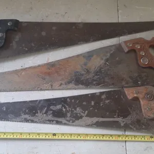 (3) Vintage hand saws.