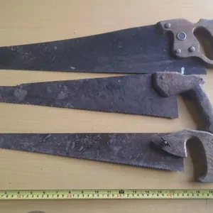 (3) Vintage hand saws.
