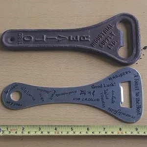Two  Bottle Openers. (One Cast Iron and One Aluminum)