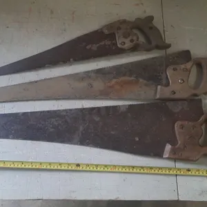 (3) Vintage hand saws.