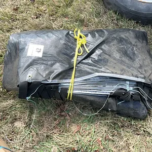 LARGE HAY TARP FOLDED UP - LOOKS TO BE LIGHTLY USED BUT CONDITION UNKNOWN