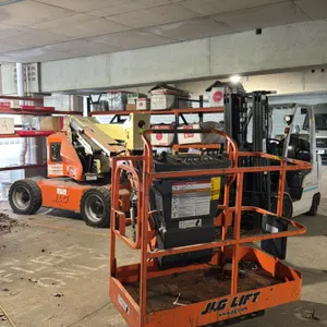 JLG E450AJ electric articulating boom lift. Features a 45' platform height, 23' horizontal reach, and 500 lb platform capacity. Hour meter reads 533.6