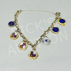 10k gold charm bracelet & 4 gold charms